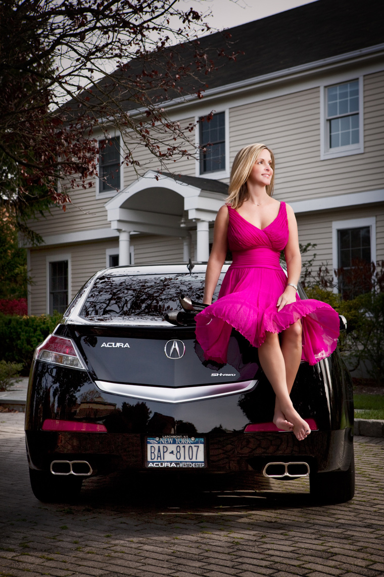 Woman sitting on a car